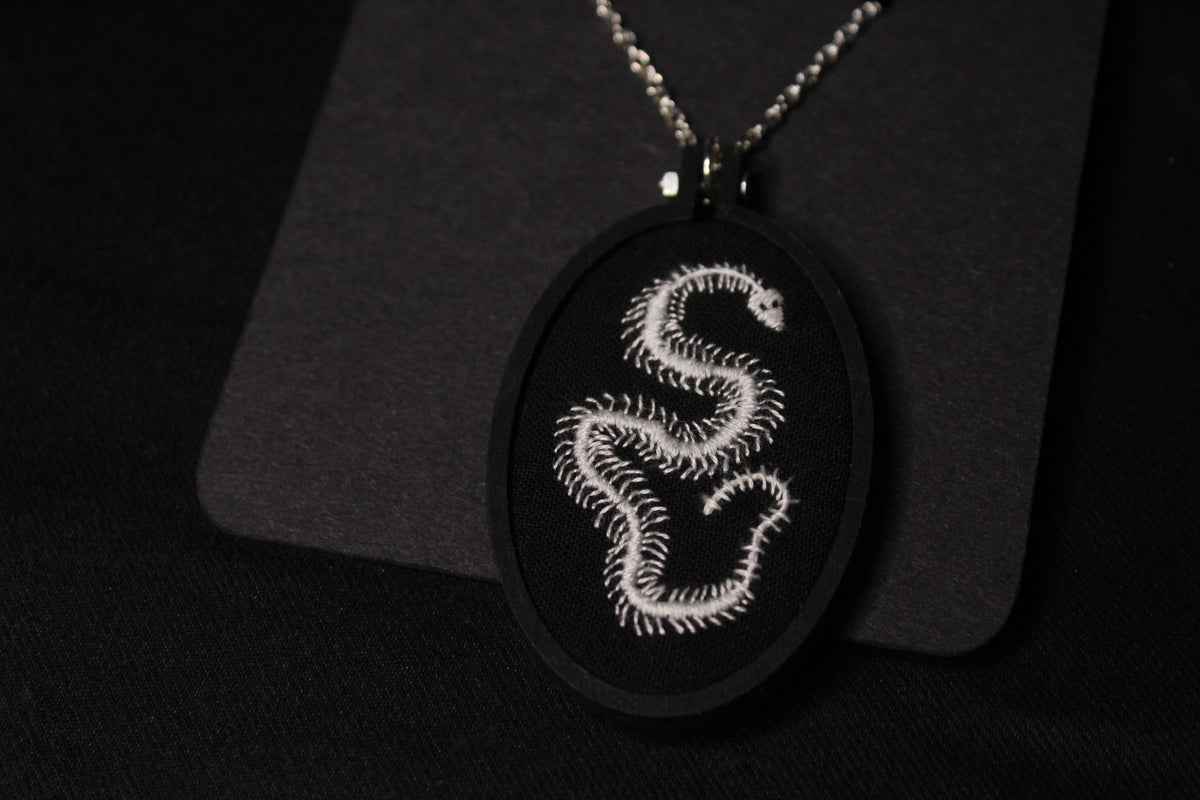 Embroidered Snake Skeleton Pendant