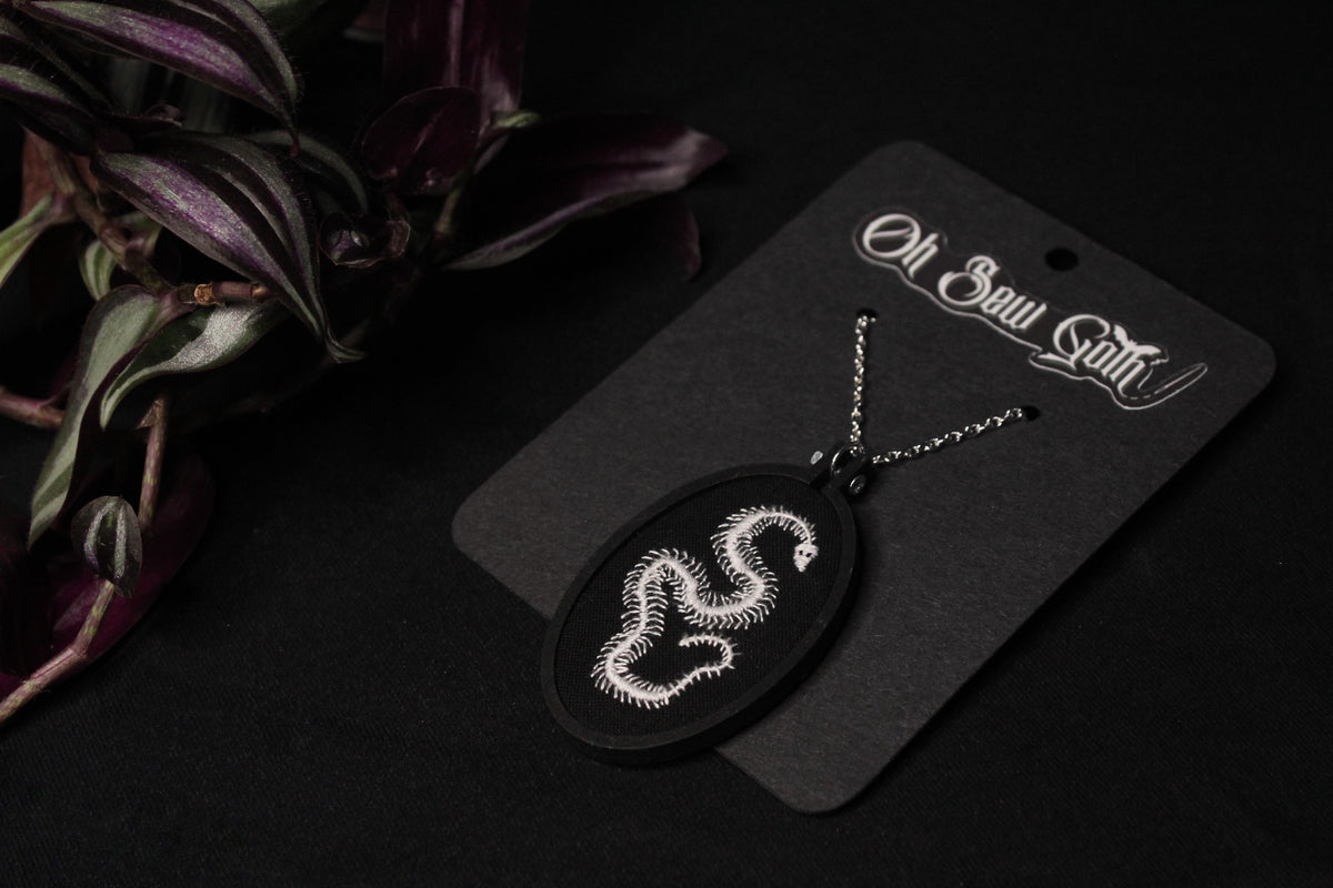 Embroidered Snake Skeleton Pendant